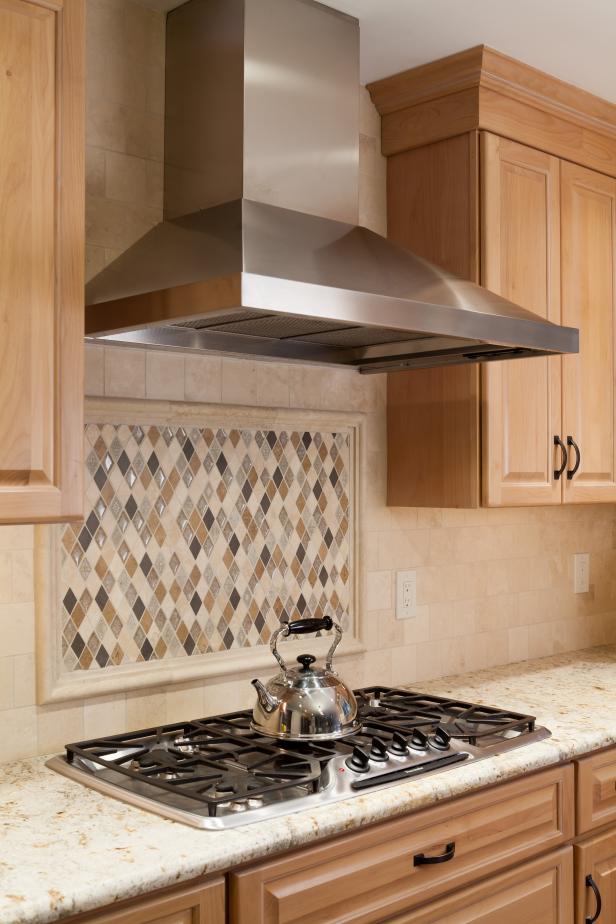 Kitchen with Diamond-shaped Tile Backsplash and Stainless Steel Range