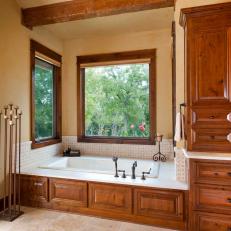 Master Bathroom with Soaking Tub, Exposed Beam Ceiling, Picture Windows and Tile Floors