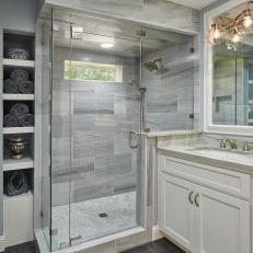 Bathroom with Glass and Marble Shower, Gray Limestone Floors, and Quartzite and Wood Vanity
