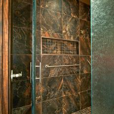 Privacy Shower With Heavy Glass Door, Stone Tiles and Cutout Shelf