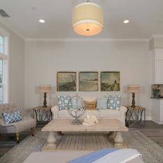 Neutral Coastal Living Room Boasts Blue Accents
