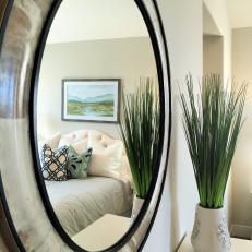 Mirror Showcases Calm, Sophisticated Master Bedroom