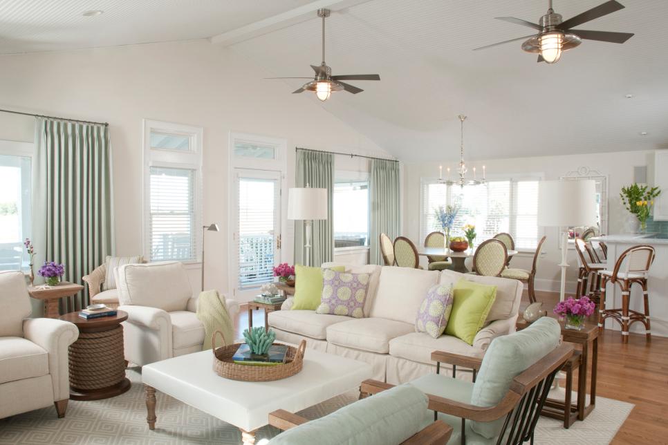 Coastal White Living Room With Off-White Sofa and Two Ceiling Fans