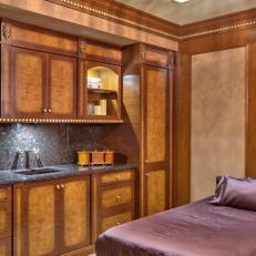 Massage Room with Wood Cabinets Plus Marble Countertops and Backsplash
