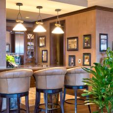 Tropical Style Bar Area with Leather Stools and Large Pendant Lights