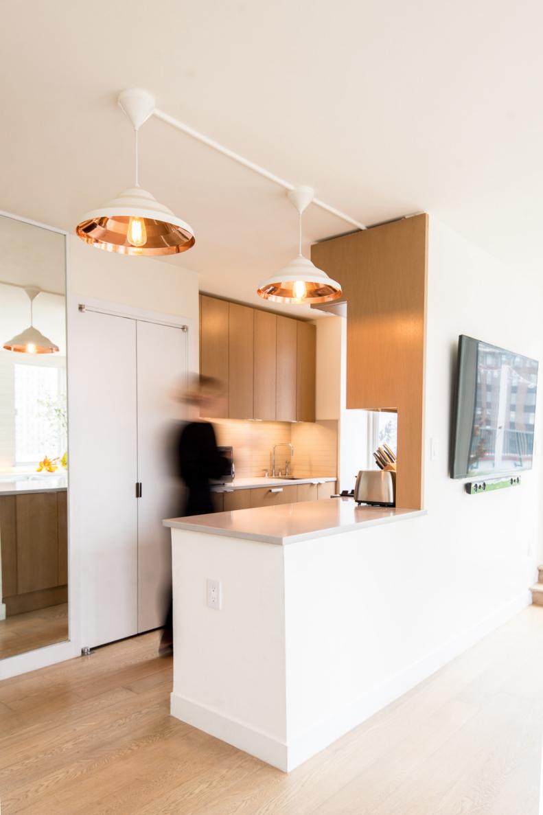 White Modern Kitchen With Pendant Lights & Light Brown Cabinets