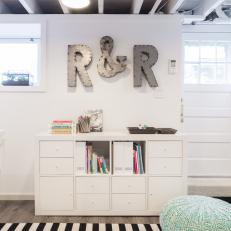 Contemporary Space With Black & White Stripe Rug and Kids Reading Area