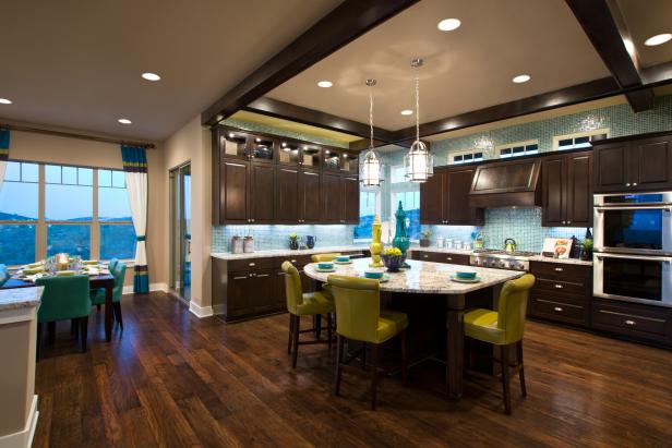 Inviting Transitional Kitchen Features Dark Cabinetry and ...