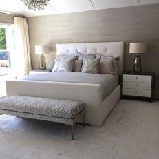 Chic Bedroom Boasts Tufted White Headboard, Silver Pillows