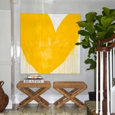 Bright Yellow Painting Invigorates Stylish Entry