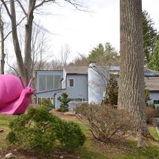 Hot Pink Snail Graces Modern Home's Front Yard