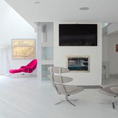 Modern White Family Room Features Space-Age Chairs