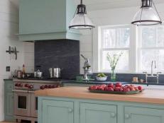 Glass Pendant Lights Over Island in White Cottage Kitchen