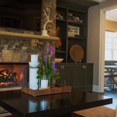 Stone Fireplace and Gray Built-In Bookshelves