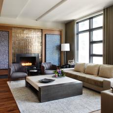 Neutral Contemporary Living Room With Gold Fireplace