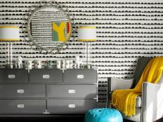 Midcentury Modern Nursery With Gray Dresser, Armchair & Yellow Accents