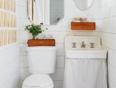 Bright Country Bathroom With Book-Page Wall Decor & Skirted Sink
