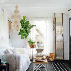 Bright, Eclectic Living Room With Exposed Ceiling Beams