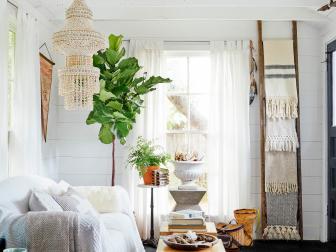 White Living Room With White Ceiling Beams and Shell Chandelier