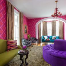 Vibrant Hotel Sitting Room With Round Purple Bench