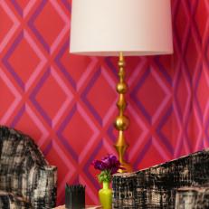 Eclectic Seating Area Boasts Hot Pink Patterned Walls