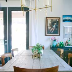 Dining Area Features Gray Farmhouse Table & Gold Light Fixture