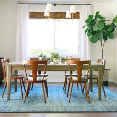 White Dining Area With Midcentury Chairs & Farmhouse Table
