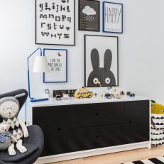 Child's Black-and-White Playroom With Framed Prints