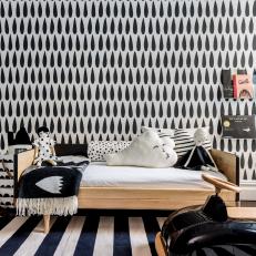 Playful Children's Room with Bold Wallpaper