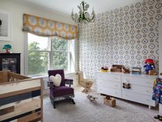 Contemporary Nursery Features Graphic Accent Wall & Purple Rocking Chair