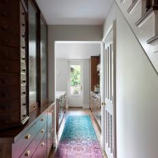 Neutral Hallway Features Bright Pink and Blue Runner