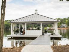 Heather Garrett Interior Design created a floating party dock perfect for lakeside entertaining, complete with a wet bar, beer kegerator, TV and swimming dock.