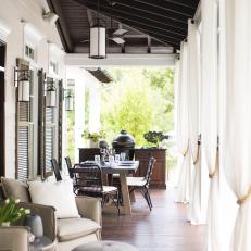 Outdoor Dining Area With White Drapery