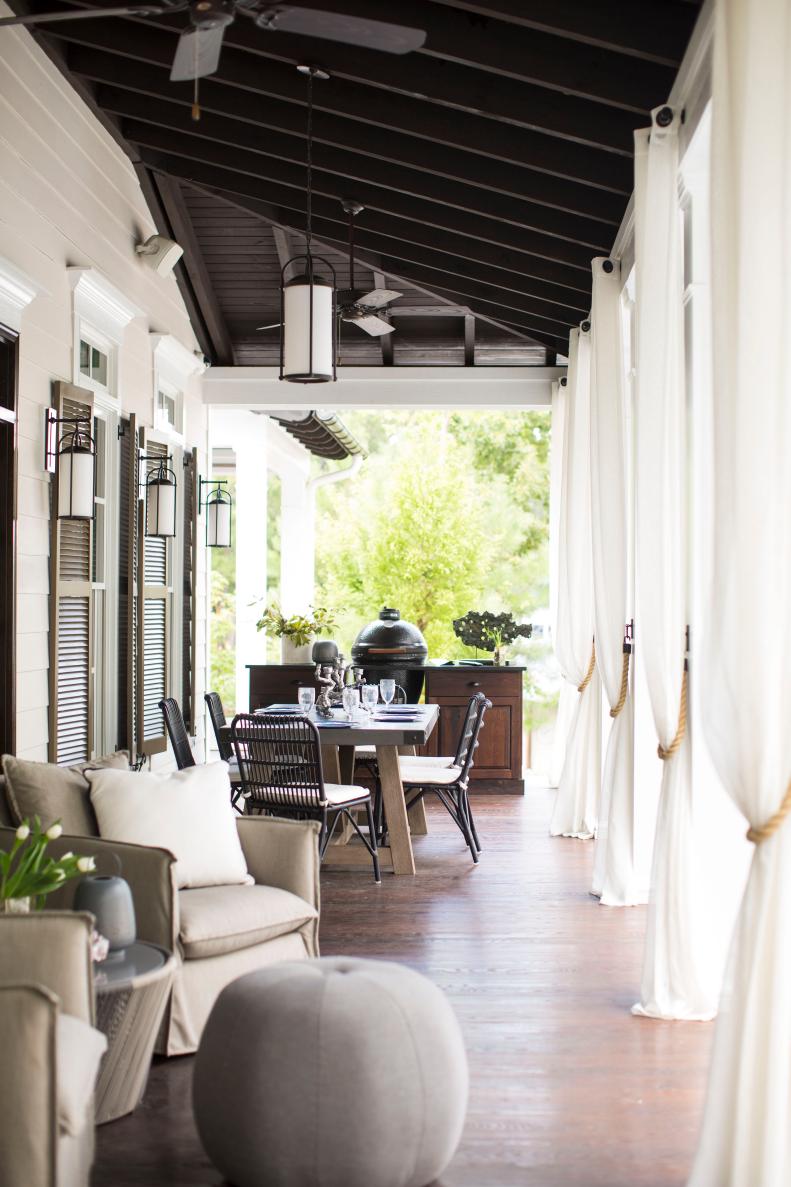 Transitional Porch With White Drapes & Neutral Upholstered Furniture