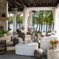 Comfy Outdoor Lounge With Fireplace & Drapery
