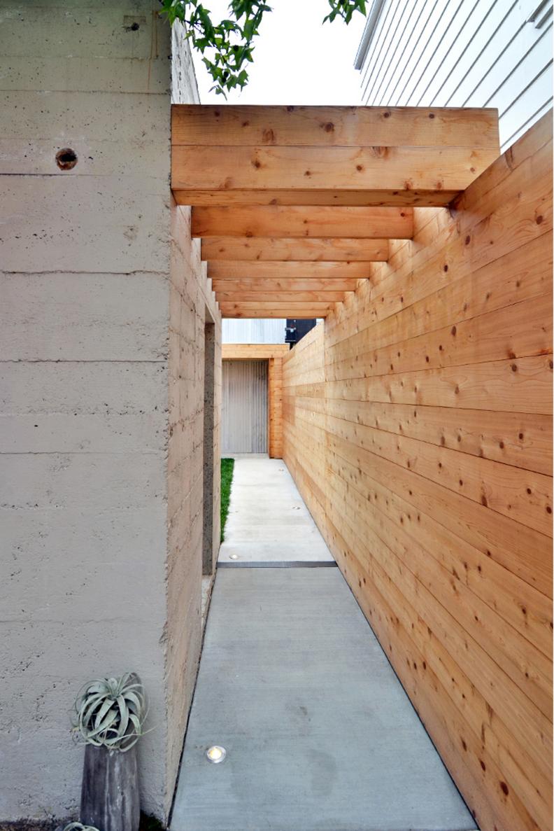 Outdoor Space With Concrete Pathway & Cedar Siding