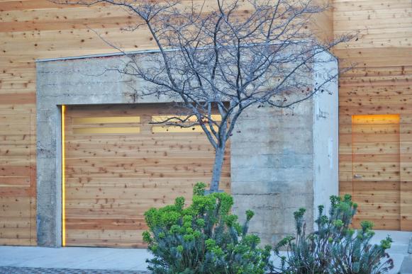Modern Exterior With Cedar Siding & Garage Door