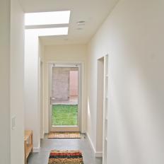Minimalist Hallway With Colorful Rug