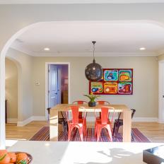 Multicolored Contemporary Dining Room With Orange Chairs