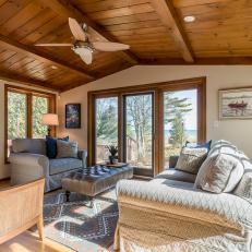 Sunroom Features Wood Paneled Ceiling & Cozy Seating