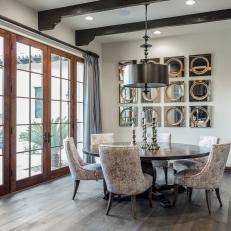 Elegant Dining Room Features French Doors & Gray Hardwood Floor