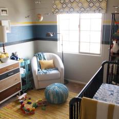 Blue and Yellow Midcentury Nursery With Pouf
