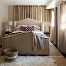 Cozy Contemporary Bedroom With Upholstered Bed Frame, White Fur Rug and Calming Mix of Neutral Tones