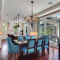 Bright & Airy Eat-In Kitchen Features Turquoise Chairs