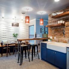 Industrial, Loft-Inspired Kitchen with Breakfast Bar and Farmhouse Sink