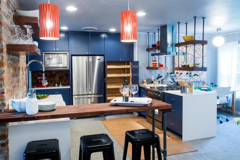 Open, Industrial Kitchen with Design Aspects that Create Boundaries