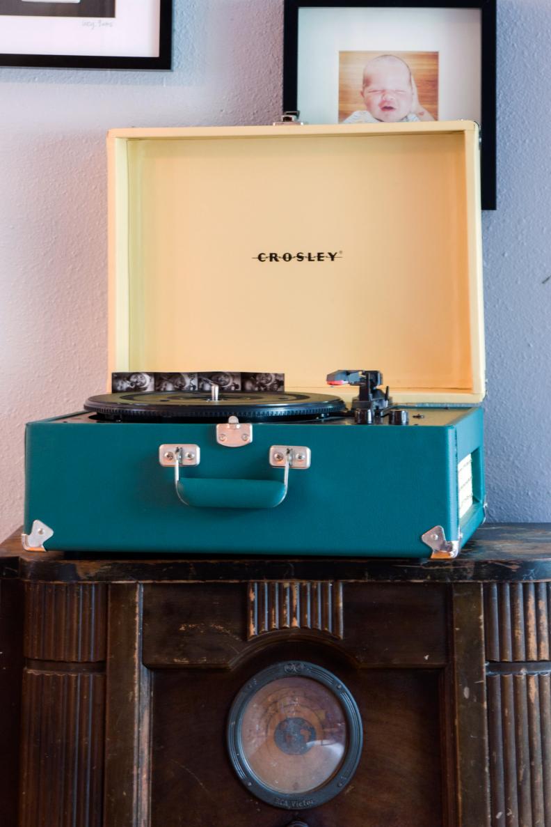 In this Austin, Tex. renovation featured on HGTV's America's Most Desperate Kitchens, the living space adjacent to the kitchen was included in the remodel. Decor includes an antique console radio and vintage-look Crosley turntable.