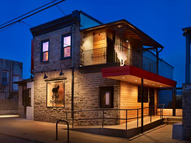 Gray Stone Restaurant Exterior With Contemporary Red-Orange Canopy
