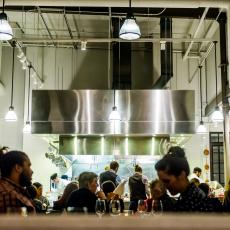 Industrial-Style Restaurant Features Exposed Kitchen