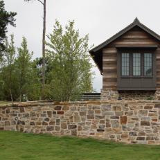 Stone Retaining Wall Adds Privacy to Lakeside Home